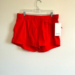 Lululemon Stroll at Sundown short 3”. Orange red Size 12. Tags on